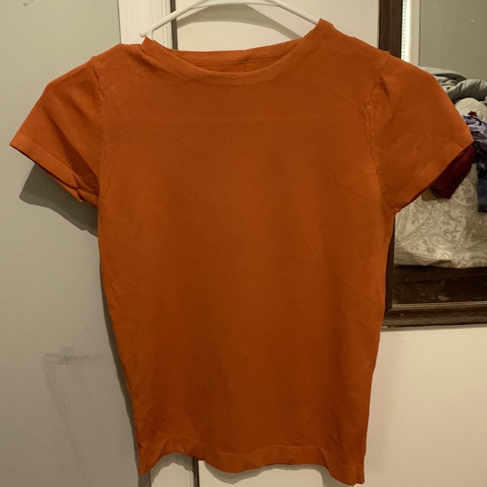 Small Warm Orange shirt. Stretchy
